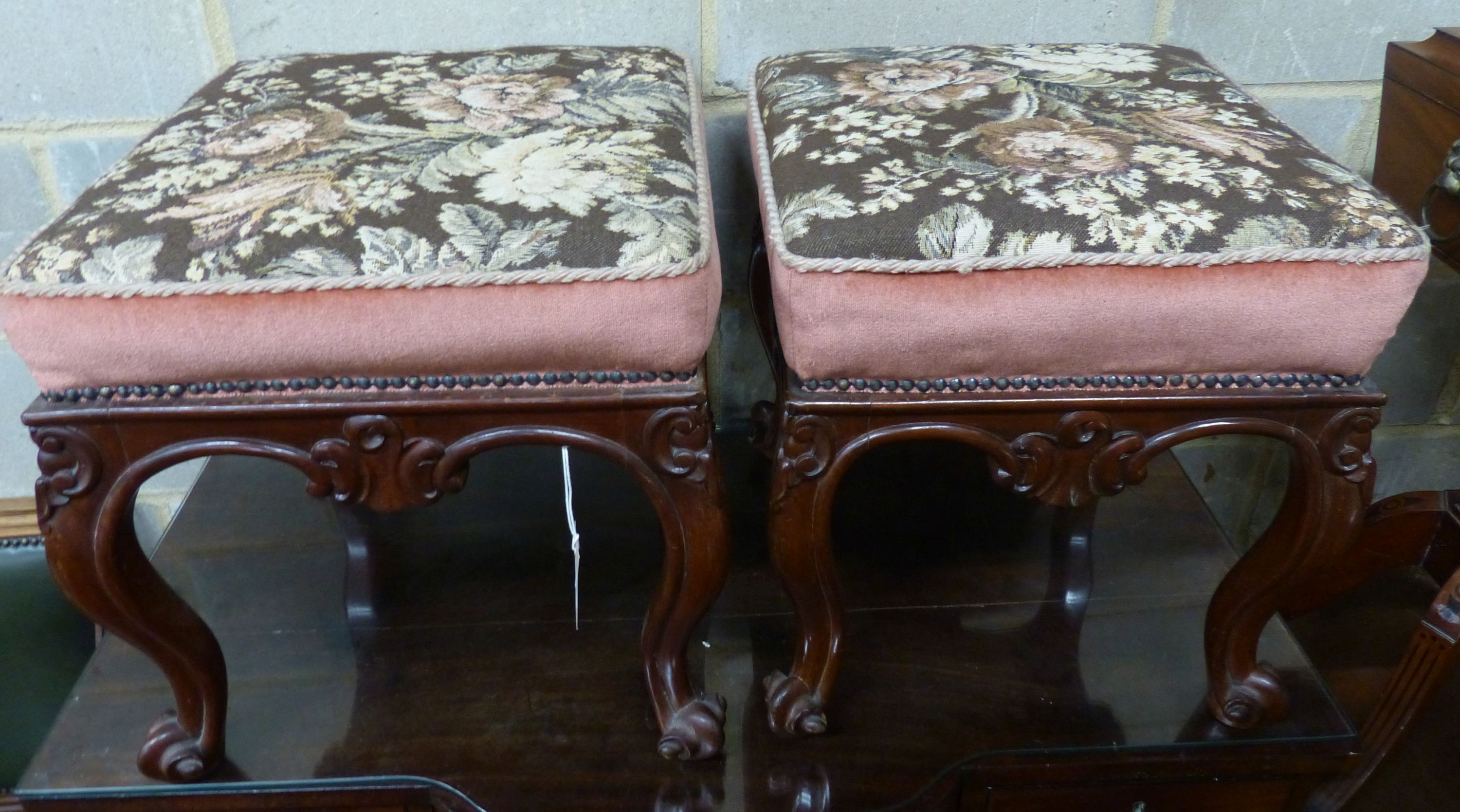 A pair of Victorian mahogany square topped tapestry upholstered stools, on cabriole legs, W.45cm D.48cm H.44cm